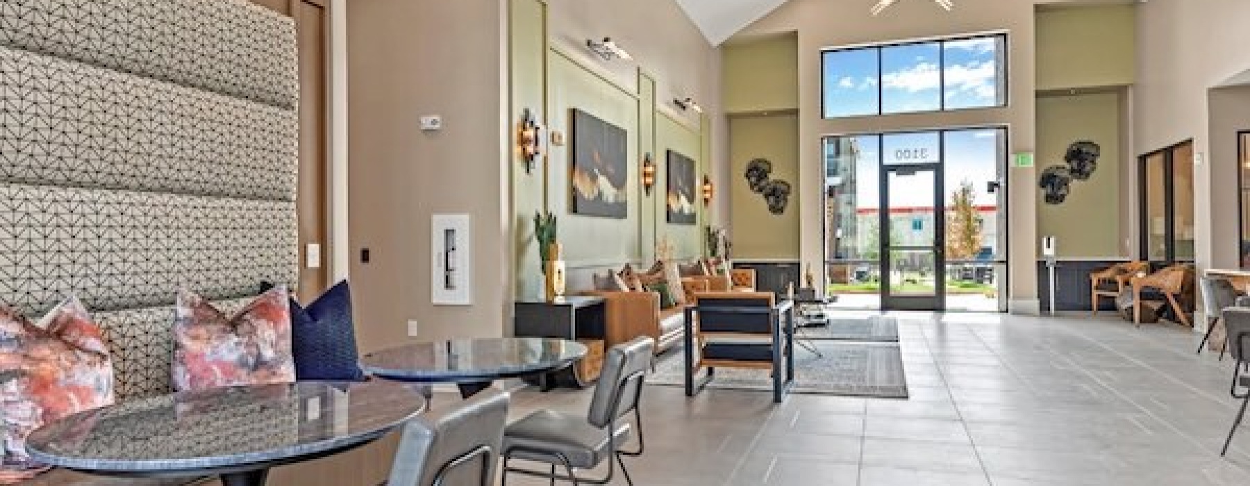 a clubroom with tables and chairs